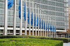European flags fly at half-mast in front of the Berlaymont